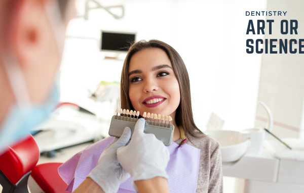 Dentist showing a patient different tooth shades for veneers or crowns, illustrating dentistry as art vs. science in dental treatment planning.
